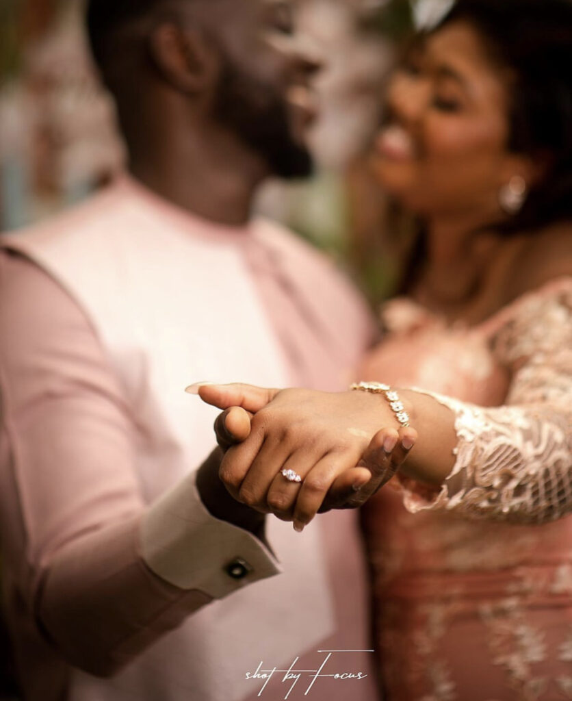 Ghanaian groom and bride showing off their lovely wedding ring