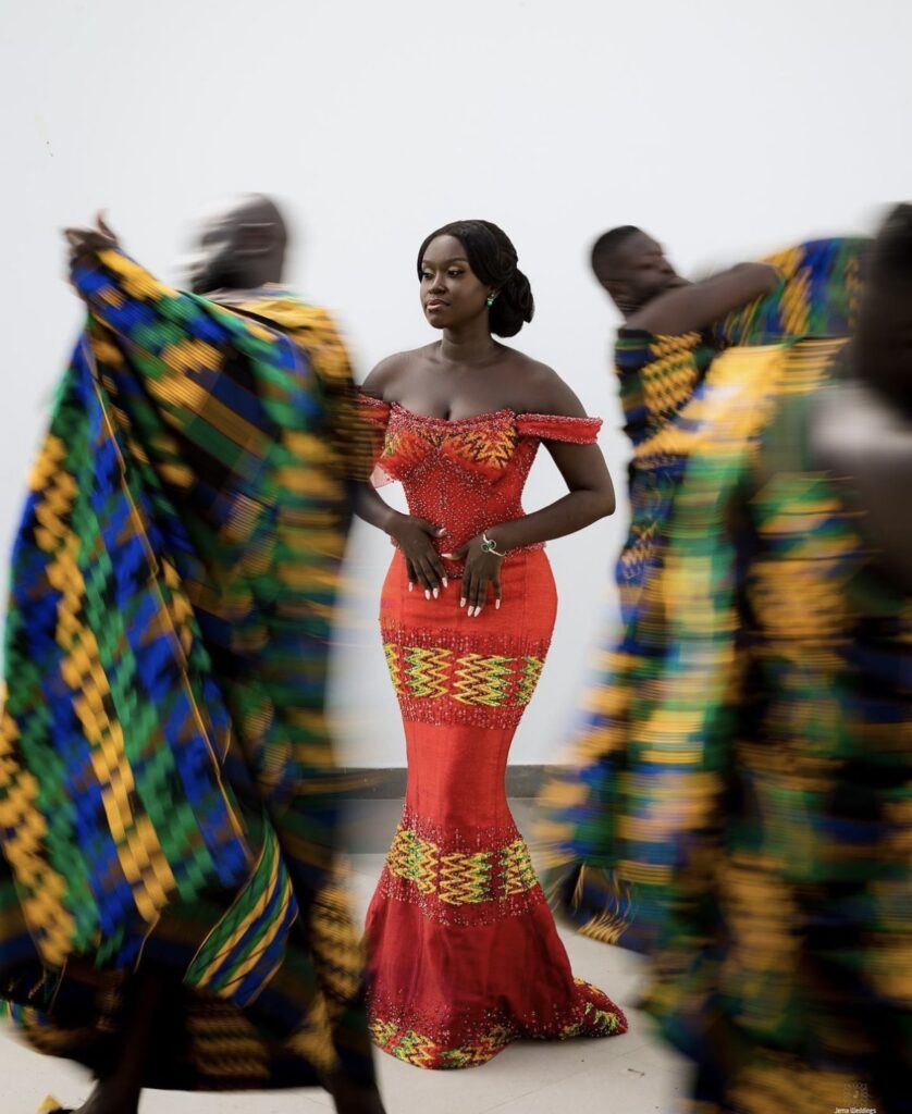 Ghanaian bride in gorgeous Kente wedding dress for her customary Ghanaian marriage ceremony.